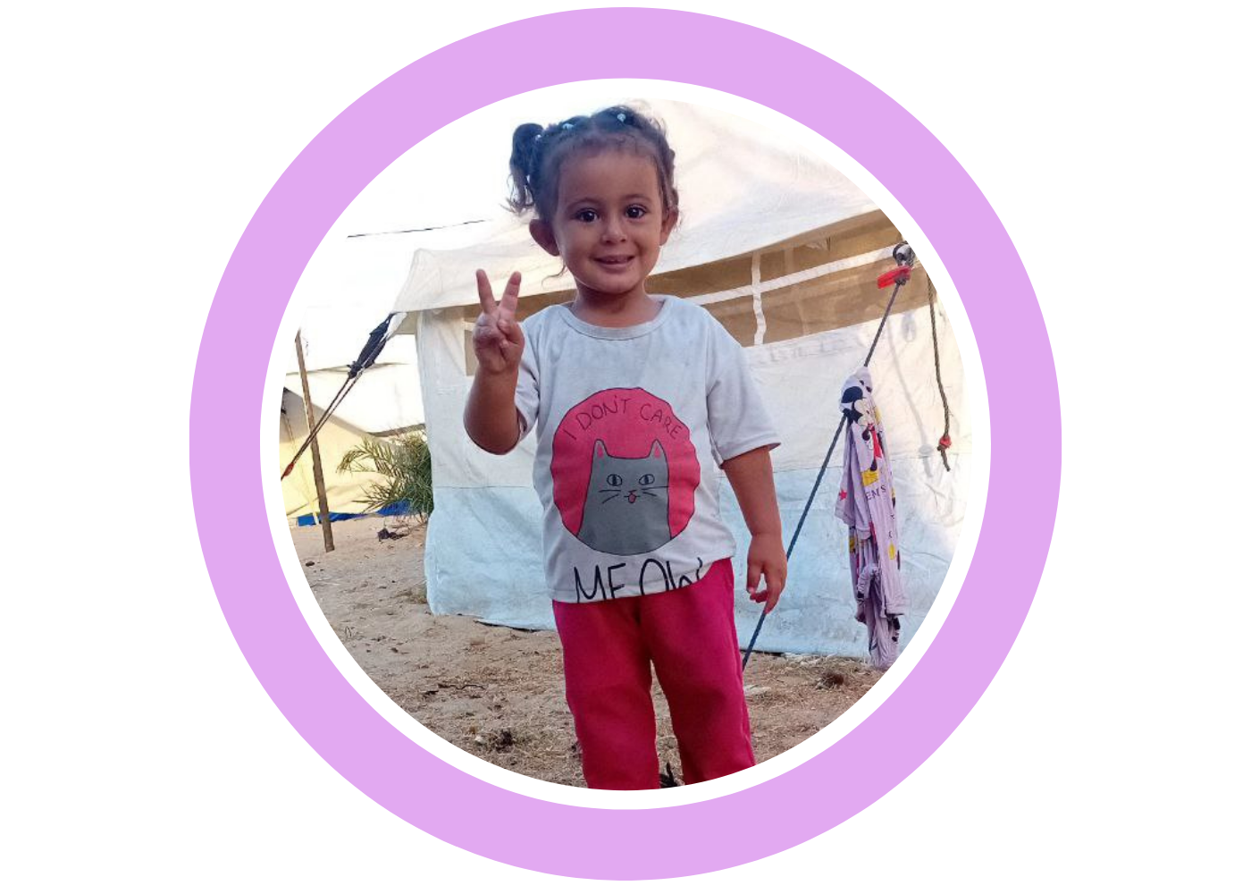 A young child standing in a tent